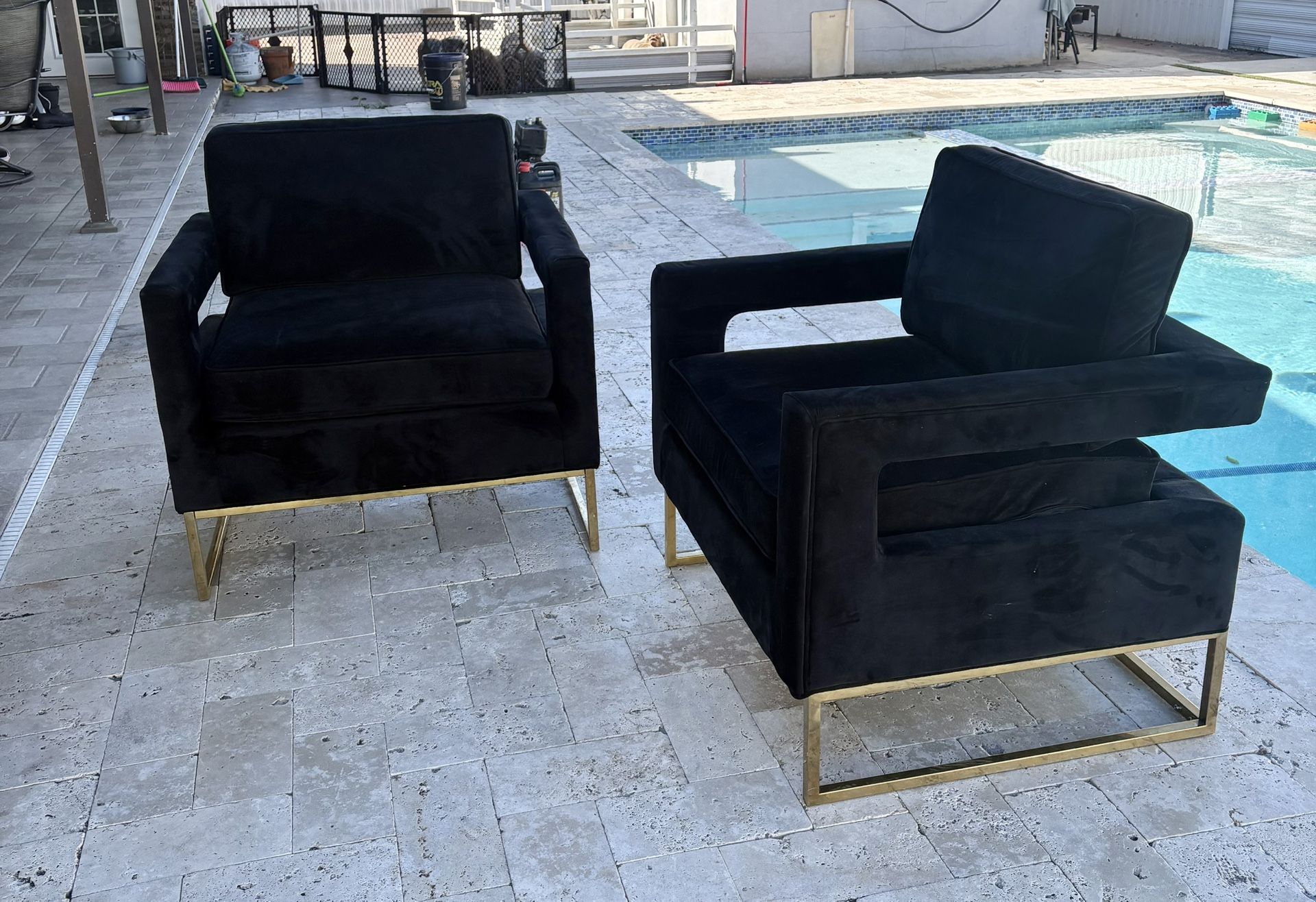 modern black velvet accent chair with a gold metal base