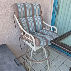 2 chairs with cushions and table