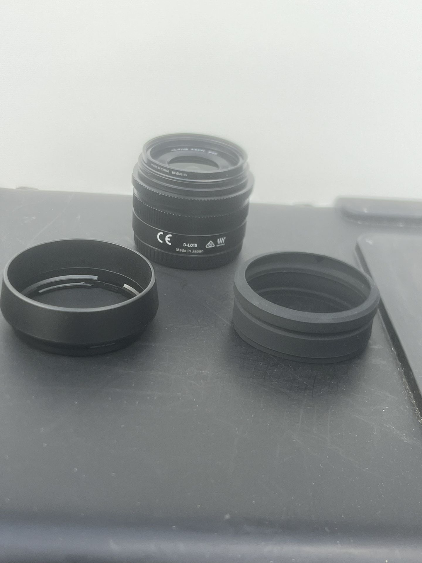 DJI D-L015 MFT ASPH 15mm Lens f1.7 Micro Drone Lens Excellent Condition. My apologies the pics do not do the lens justice. A lens cover broke on my ph