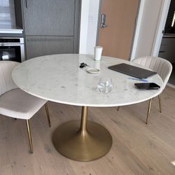 Crate & Barrel white marble dining table