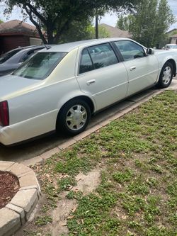 2005 pearl white Cadillac Deville