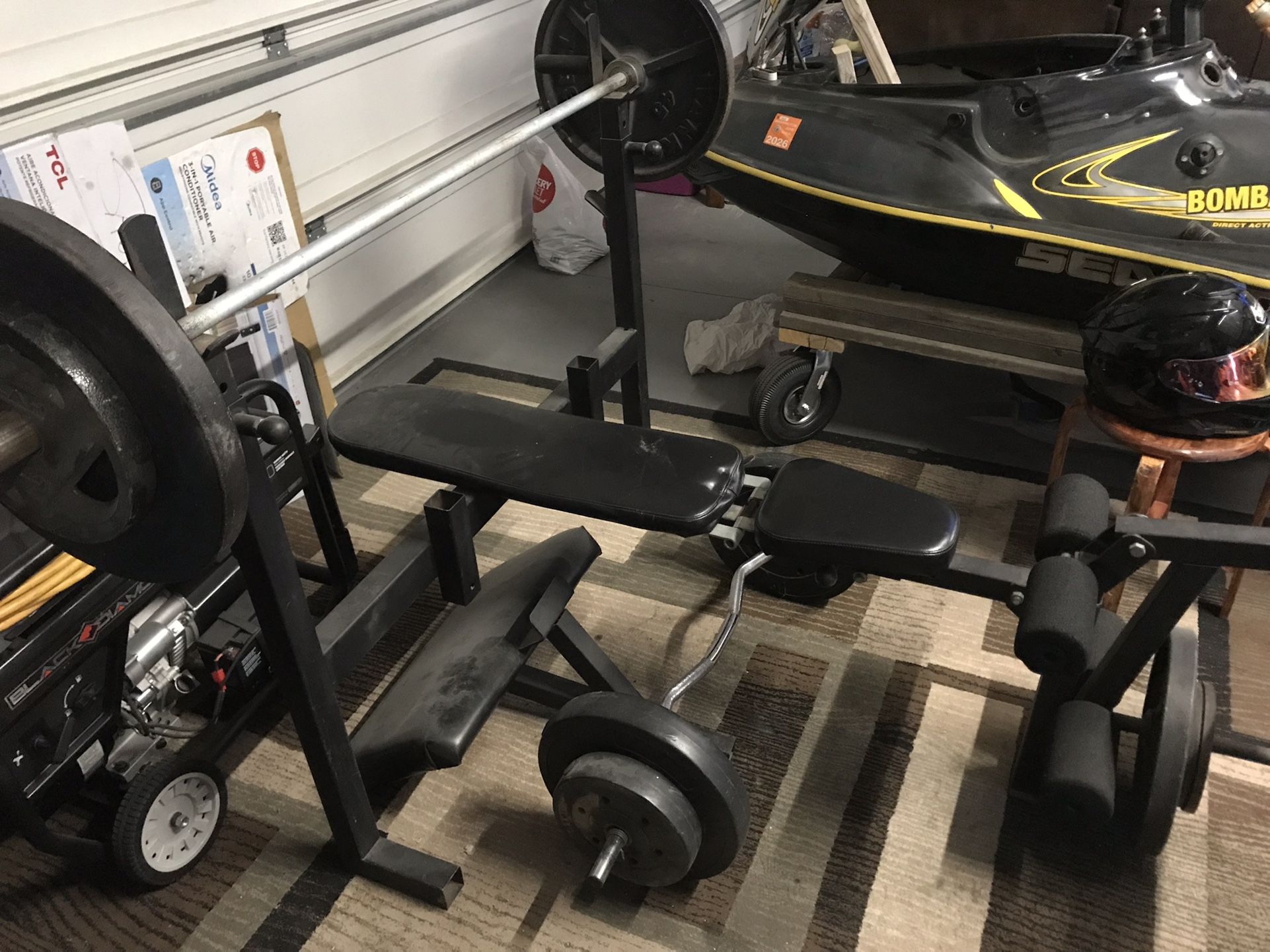 Weight Bench And Curl Bar With Olympic Weights and Bar