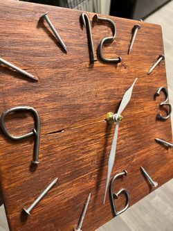 Bent nail wooden wall clock