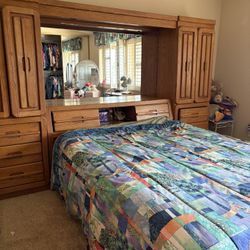 Free Solid Oak Bedroom Wall Unit with Mirrored Headboard & Storage 
