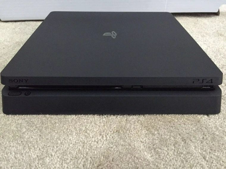 1TB PS4 Slim w/ 2 Controllers, Bluetooth Headset & Charging Doc. 