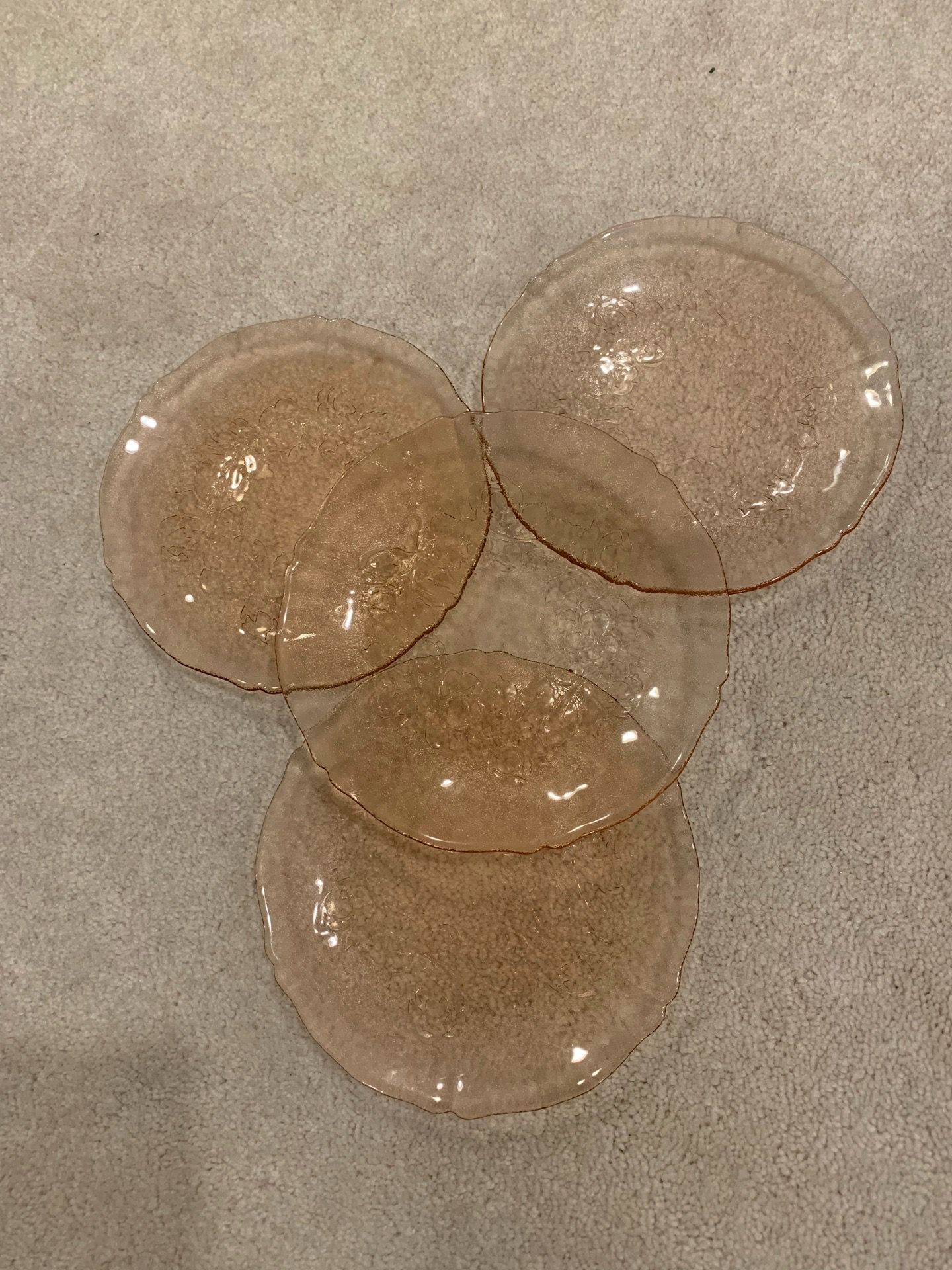 4 Small pink glass plates
