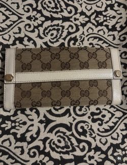 Gucci GG Canvas Continental Wallet with beige canvas