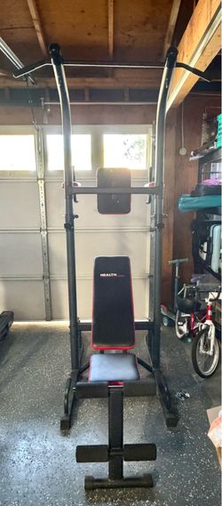 Weight bench, pull up bar power tower, spin bike and rowing machine