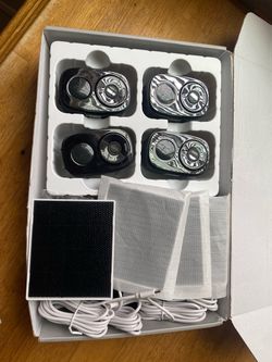 wireless security camera system (Model W1), packaged as a 4-camera kit with accessories