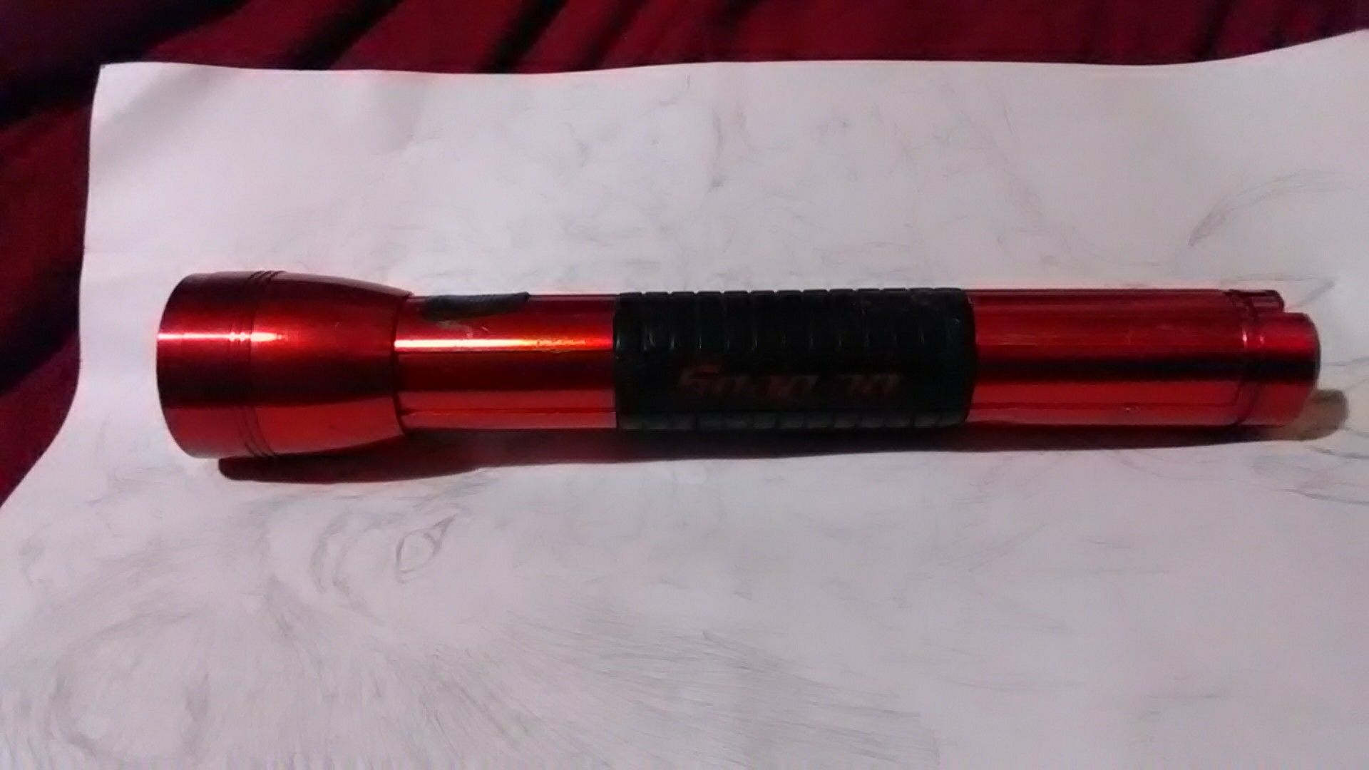 Snap-on flashlight