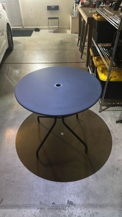 Patio table with hole for umbrella