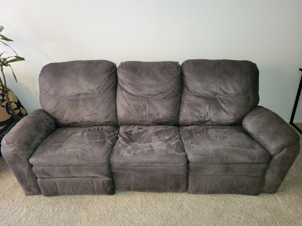 Reclining Couch, sit/stand desk, large office chair, large mirrors, Entertainment Center/tv Stand, coffee table.
