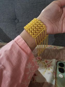 Gold-Tone Filigree Bracelet with Tassel Chains