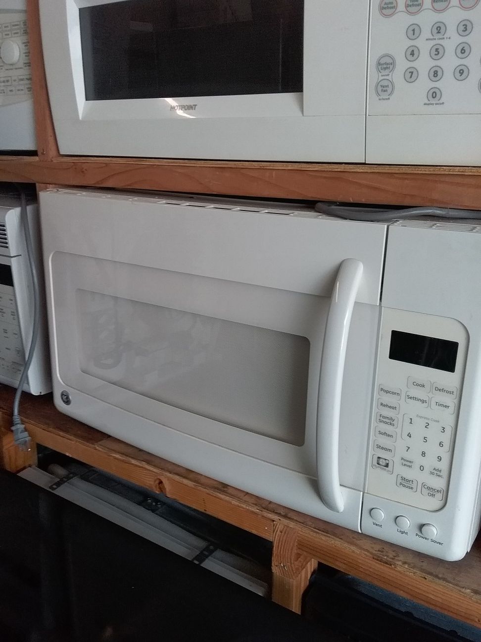 Off white ge over the range microwave bracket and screws included in excellent working condition