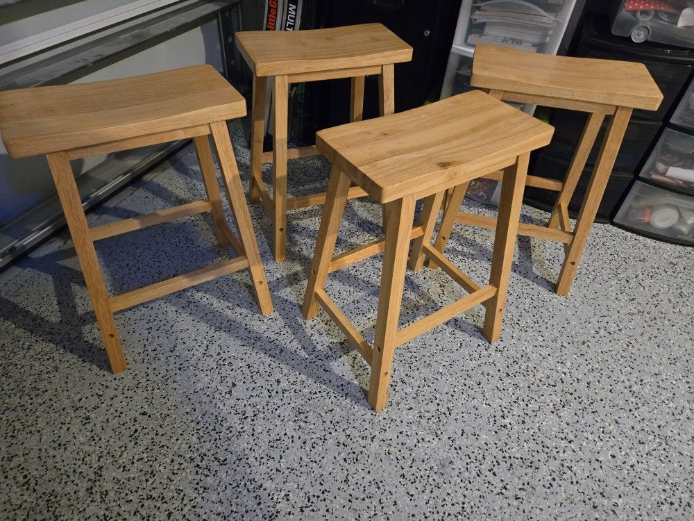 (4) Wooden Counter/Bar Stool made in Malaysia. They only had a few months of use. We changed to chairs with a back.
