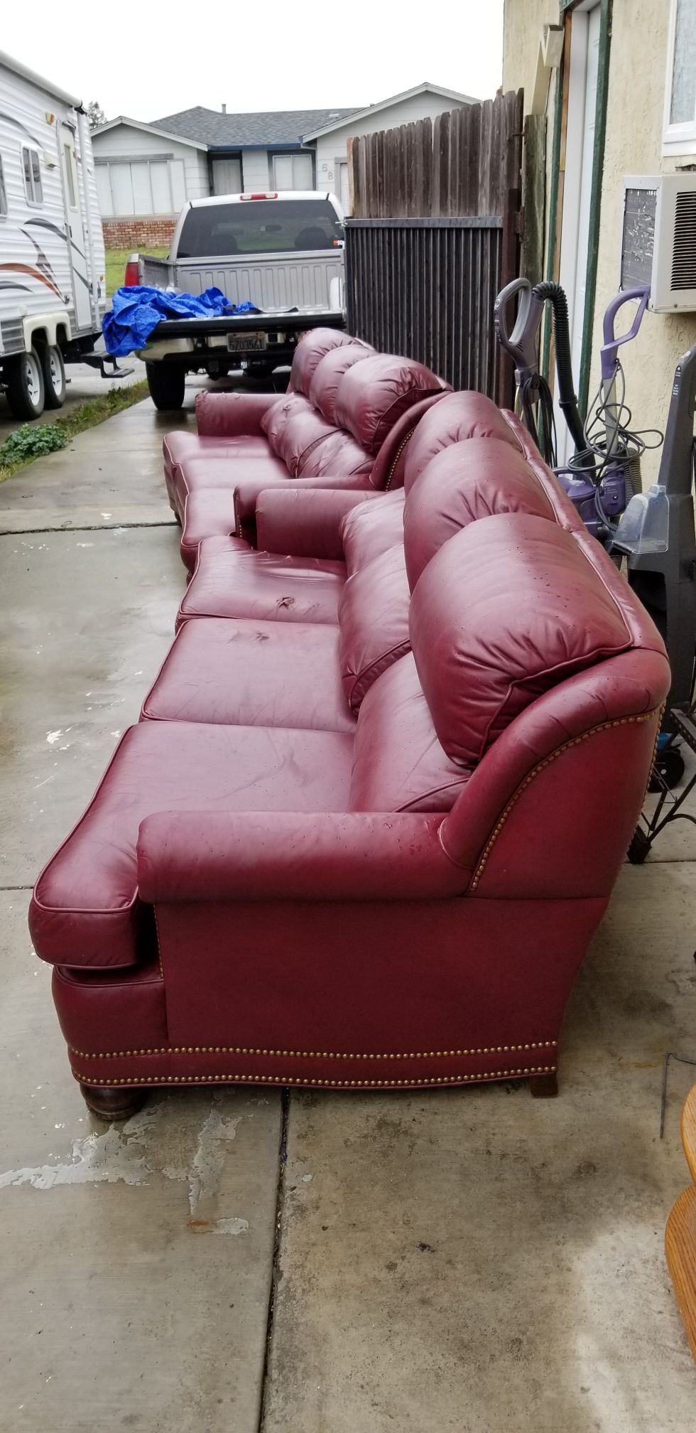 Red leather couches (2)