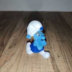 2011 Peyo SMURFS McDonald's Gutsy Smurf Happy Meal Toy. Has wear from age and storage. Sold as is.