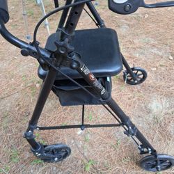 USED EQUATE WALKER W/ CHAIR & POUCH