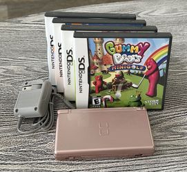 Metallic Gold Nintendo DS with 4 games, complete with stylus & charger. $65