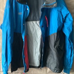 Vintage Columbia Sportswear radial sleeve jacket features a blue and black color-block design with red zipper ac