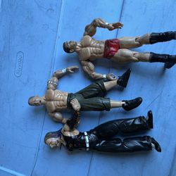 Toy Wrestlers One Has A Broken Arm