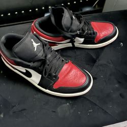 Women size 9 Jordan 1s low red and black
