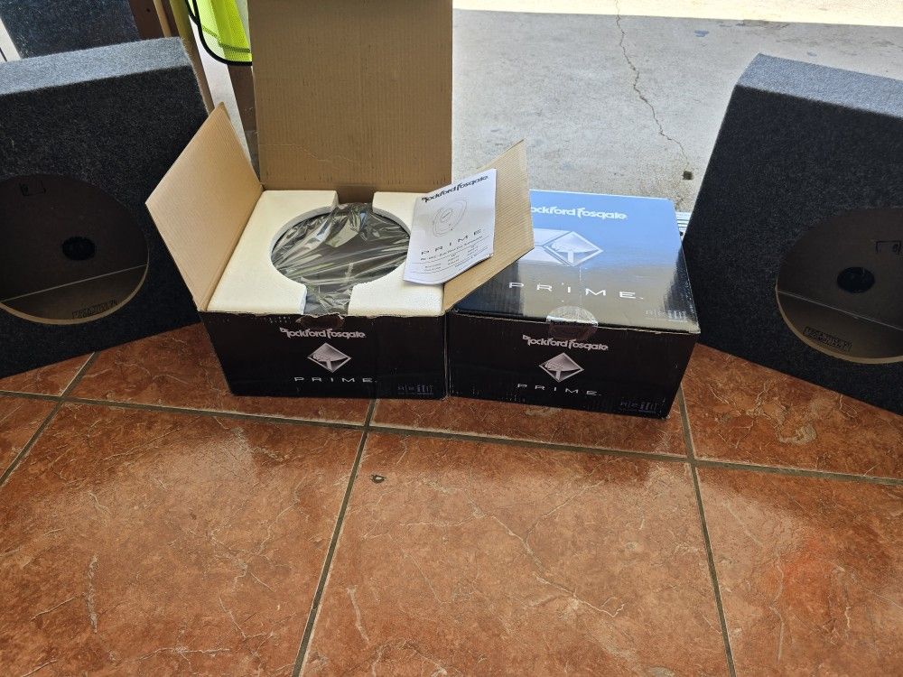Two 10" Rockford Fosqate Subwoofers With Housings
