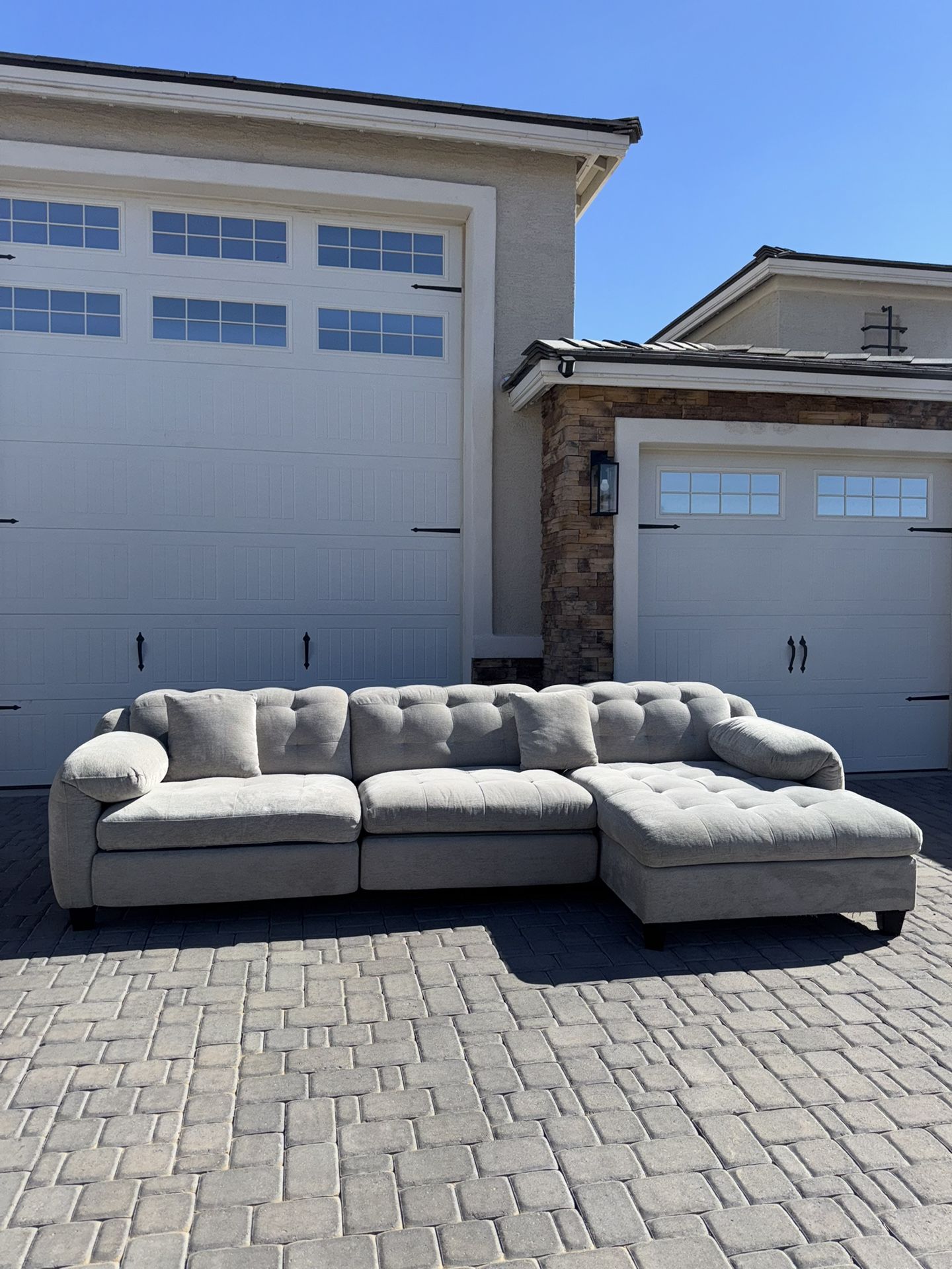 Three piece grey sectional with electric recliners
