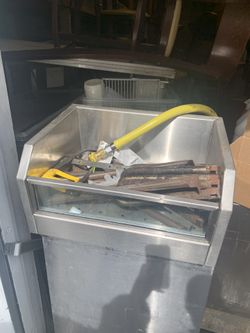 Ice chest for bar with drain line.