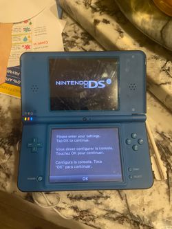 Nintendo DSi XL with original games, charger and case 