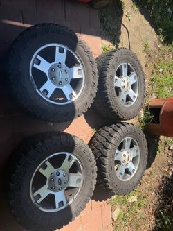 33x12.50R18LT" OEM Ford F-150  Wheel with Mud-Terrain Tire & Center Cap