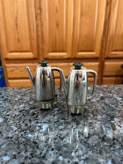 Vintage Coffee Percolator Plastic Pair of Salt Pepper Shakers.  Size approximately 3 inches tall.  Preowned.  Has been on display in a cabinet with a 