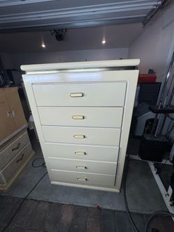 Tall dresser with gold finished