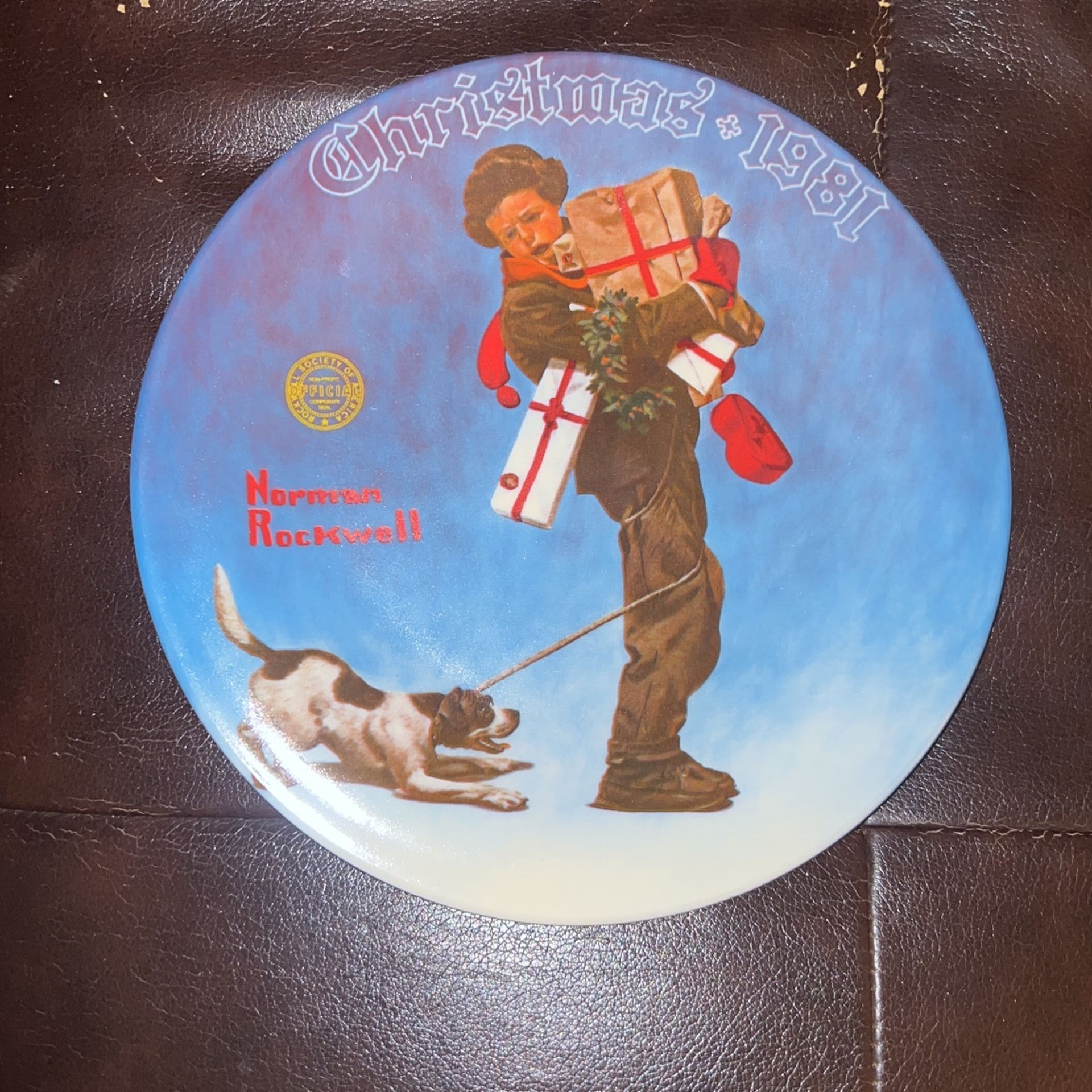 1981 Norman Rockwell Plate “Wrapped Up In Christmas”