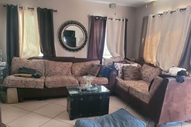 Entry table, storage trunks, wall decor, mirrors,  metal fruit basket & sectional couch