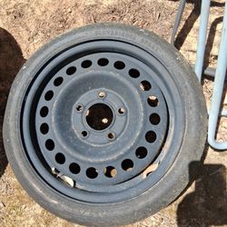 This item is a compact spare tire,  "donut," 