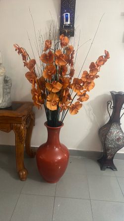 Orange vase with flowers