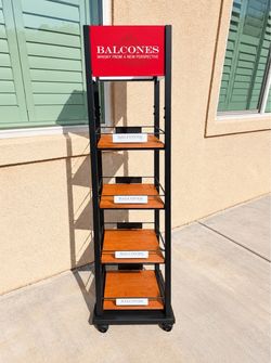 Balcones branded display shelf with multiple wooden tiers.