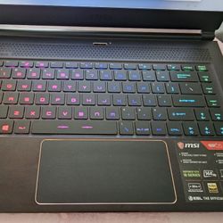 MSI GS65 Stealth THIN-054 15.6" 144 Hz FHD GTX 1070 8 GB VRAM i7-8750H 16 GB Memory 256 GB NVMe SSD Windows 11 Home 64-Bit Gaming Laptop