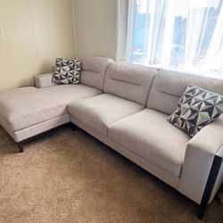 Gray couch with pillows