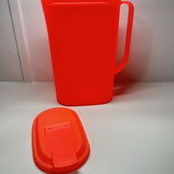 Tupperware pitcher in a reddish orange color