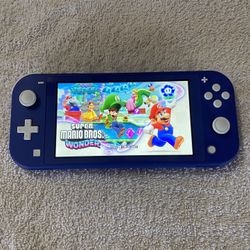NINTENDO SWITCH LITE INCLUDING 100 SWITCH GAMES