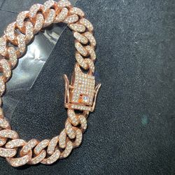 Rare red rose, gold lab ice bracelet gently used missing one stone