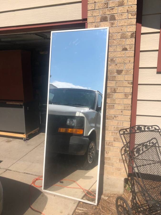 Very large. Over sized. Framed mirror