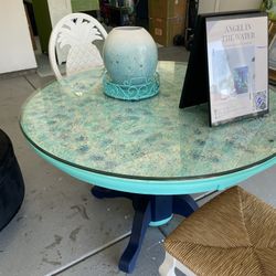 2 White And Wicker Pineapple Chairs And Chalk Panted Fun Oceanic Solid Oak Table Shells  On Table For Texture With Glass Top.  