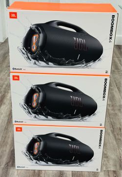 New JBL Boombox 4 portable speaker. This black speaker is IP67 waterproof and dustproof with up to 24 hours of playtime. It has a built-in powerbank a