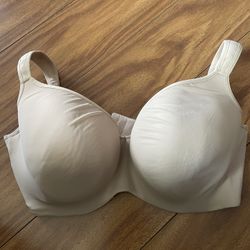  Cacique bra is a nude beige color with a 42DDD size 