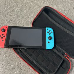 Nintendo Switch + Compact Case.