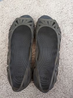 Women's Crocs waterproof flexible jelly flats in gray, size 6