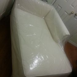 white fabric chaise lounge